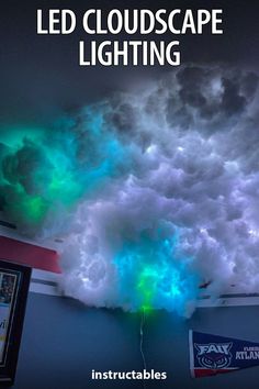 an image of clouds that look like they are floating in the air with green and blue lights