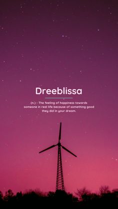 a windmill with the words dreeblissa on it in front of a purple sky