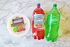 three different types of drinks on a marble surface