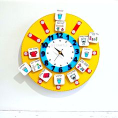 a clock made out of magnets with words on it