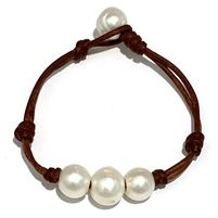 photo of Wendy Mignot Daisy Three Pearl Freshwater Pearl and Leather Bracelet Elegant Handmade Leather Bracelet, Handmade Elegant Leather Bracelet, Knotted Pearl Bracelet, Handmade Adjustable Luxury Pearl Bracelet, Elegant Round Adjustable Leather Bracelet, Elegant Adjustable Brown Pearl Bracelet, Adjustable Hand-strung Pearl Bracelet For Beach, Leather Pearl Bracelet, Leather Pearl Jewelry