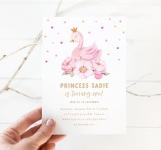 a person holding up a card that says princess sadie is turning one with flowers and a bird on it