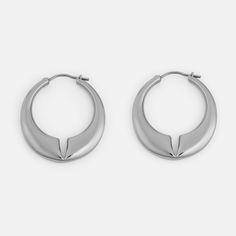 The Lune is a contemporary hoop earring with rounded edges and a deep notch at the center of the design. The domed effect tapers towards the ends, finishing with a minimal pin closure. Materials: Stainless Steel Modern Metal Hoop Huggie Earrings, Modern Nickel-free Hoop Earrings For Formal Events, Modern Nickel-free Hoop Earrings For Formal Occasions, Modern Metal Huggie Earrings For Everyday, Minimalist Metal Hoop Earrings With Polished Finish, Modern Metal Small Hoop Huggie Earrings, Modern Small Hoop Metal Huggie Earrings, Modern Metal Huggie Earrings, Minimalist Teardrop Hoop Earrings With Polished Finish