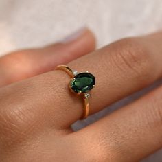 BESTSELLER! Green Tourmaline Engagement Ring/14k Tourmaline Ring/Natural Gemstone/3 Stone Ring/Delicate Gold Ring/Wedding Anniversary Gift Get ready to shine with our Bestseller Green Tourmaline Engagement Ring! Made of shiny 14k/18k gold and featuring a natural green gemstone, it's perfect for adding a pop of color to your special day or anniversary. This delicate 3-stone ring is a timeless gift that's sure to be cherished forever. ★ ★ ★  CUSTOM/DUTY-FREE SHIPPING WORLDWIDE, BUYERS DON'T HAVE TO PAY ANY CUSTOM FEES WHILE IMPORTING ★ ★ ★ ★  Details ★ Made to order Material: 14k/18k gold Color Options: Yellow Gold, White Gold, Rose Gold ★ Center Stone Green Tourmaline, Oval Size: 6x8 mm Approx Weight (Ct): 0.92 ★ Accent Stones Diamond/Moissanite Round Size: 1.5 mm * 2 No.s Approx Weight (Ct Wedding Ring Natural Stone, One Stone Rings Gold, Gemstone Ring Designs For Women, Wedding Ring Green Stone, Engagement Ring Green Stone, Timeless Green Rings With Accent Stones, Gold Rings Green Stone, Ring Design With Stone, Stone Ring Design Gold