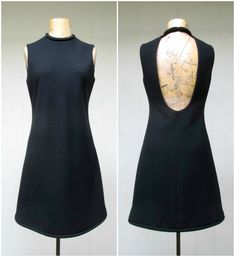 * Iconic Pierre Cardin MOD minimalist dress c 1967-1969 * Space Age A line silhouette * Bias cut black wool * Rolled, tubular collar and hem * Back is open in elongated keyhole shape * Hidden snap closure at rolled ends of neckline * Center back metal zipper closure * Fully lined in black rayon Label: Pierre Cardin, Robinson's * 2nd to last image is a similar Cardin dress in the Guggenheim Museum c 1966.* * Last image shows a dress from this same line sold at Sotheby's auction in 2018. * Excelle Pierre Cardin Space Age, Rolled Collar, 60s Mod, 60s Dress, Mod Dress, 60s Fashion, Pierre Cardin, Wool Dress