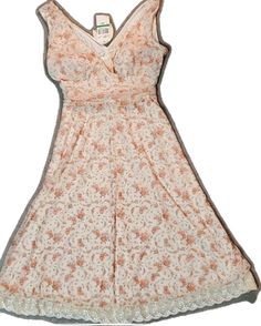 Cream Lace Dress With Floral Print, Cream Sundress With Lace Trim, Peach Sleeveless Lace Dress, Vintage Lace V-neck Dresses, Sleeveless Peach Dress With Lace Trim, Peach Sleeveless Dress With Lace Trim, Feminine Peach Lace Dress, Vintage Sleeveless Dress With Delicate Lace, Peach Lace Trim Dress For Summer