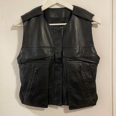 Black Lambskin Vest, New With Tags. Super Soft Leather With Interior Lining, Multiple Pocket Detailing. Luxury Black Vest For Workwear, Luxury Black Vest For Fall, Luxury Black Biker Jacket With Pockets, Black Luxury Biker Jacket With Pockets, Black Leather Vest, Zipper Vest, Coats Black, Suede Vest, Green Vest