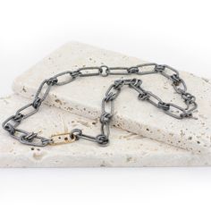 This simple yet bold silver chain radiates confidence. The oxidized textured links really make the yellow gold-filled link POP! This chain has a very nice weight. Great to stack with other necklaces. Recycled sterling silver Dark gunmetal finish - other finishes are also available 14k gold-filled link - solid gold link is available 16" with a 2" extender Handmade hook closure The necklace is completely hand fabricated in my studio. Custom length or additional gold links can be added also. Please Heavy Chain, Gold Link, Recycled Sterling Silver, Rope Bracelet, Silver Chain, Solid Gold, Gold Filled, Silver Bracelet, Yellow Gold