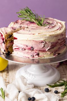 there is a cake that has been cut in half and served on a platter