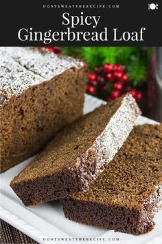 two slices of spicey gingerbread loaf on a white plate