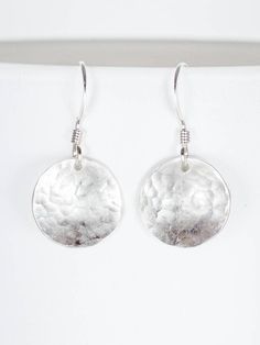 Hammer time! You'll love my hand hammered Domed Sterling Silver Disc Earrings!  These convex earrings include a 1/2 inch domed out disc.  The Length of the domed earring is 1 inch from the top of the French Hook Earwire to the bottom of the disc.  These dainty, dangle earrings go great with any outfit! Link to 1/2 Inch 14k Gold Fill Convex Hammered Earrings:  https://www.etsy.com/listing/527105528/domed-earrings-12-inch-gold-circle?ref=shop_home_active_1 What is 14k Gold Fill? It contains a thick layer of 14k gold and will last you a lifetime, and it's safe for most people with sensitive skin or allergies. Clean it periodically with a polishing cloth like you do with sterling silver. * Tracking included I hand make everything myself with love, care and an eye for detail in my studio in Aus Dainty Dangle Earrings, Silver Circle Earrings, Hammered Earrings, Gold Circle, Silver Circle, Disc Earrings, Earrings Dainty, Pretty Green, Green Gifts