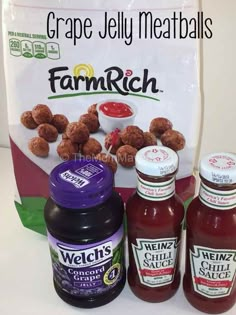 three jars of ketchup and two bottles of sauce next to a bag of grapes jelly meatballs