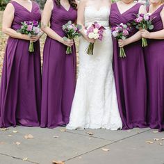 the bride and her bridesmaids are all dressed in purple