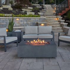 a fire pit sitting on top of a stone patio