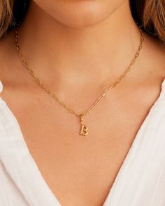 Description Personalize your favorite chain necklace with this playful helium alphabet charm. Wear your initials or a loved one's - you can make a set here. Product Details Total drop 11/16" Letter measures 5/16" by 3/8" Hinge closure measures 3/16" by 5/16" Available in 18k gold plated brass Avoid contact with anything containing derivatives of alcohol Gold Initial Necklace With Paperclip Chain For Everyday, Dainty Initial Necklace With Charms, Gold Monogram Initial Pendant Necklace, Personalized Dainty Initial Pendant Charms, Dainty Everyday Charms With Initial Pendant, Dainty Personalized Initial Pendant Charms, Dainty Everyday Initial Pendant Charms, Yellow Gold Monogram Initial Necklace, Personalized Yellow Gold-plated Charms