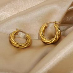 Add some edge to your accessory collection with this cool twist hoop.  Plating: 18K Gold | Stainless steel Hypoallergenic Modern Twist Hoop Earrings As Gift, Twist Earrings, Modern Earrings, Dainty Earrings, Girls Jewelry, Sterling Silver Hoops, Stainless Steel Earrings, Gold Texture, Circle Earrings