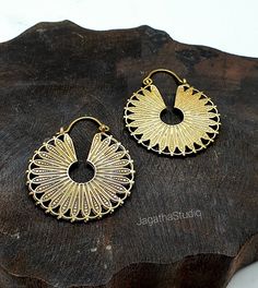 HANDMADE Beautiful Mandala hoop earrings. Ideal for everyday wear or for a special bohemian look. SIZE Aprox Length: 4.6 cm Aprox diameter: 3.8 cm Handmade with high quality hypoallergenic Jewelery brass, nickel free. LINK Please follow the link to view my shop for other beautiful pieces. https://www.etsy.com/uk/shop/JagathaStudio Festive Oxidized Finish Hoop Earrings, Festive Round Hoop Earrings With Oxidized Finish, Bohemian Round Metal Plug Earrings, Gold Hippie Jewelry For Festival, Vintage Gold Hoop Earrings For Summer, Hippie Brass Jewelry For Festivals, Hippie Gold Jewelry For Festivals, Hippie Gold Festival Jewelry, Bohemian Hoop Earrings With Ear Wire For Summer