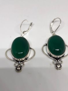 Antique vintage Green Chrysoprase Silver dangle earrings Delicate and detailed hand set vintage green chrysoprase Antique and Silver leverback earrings These dangle earrings are about 2 inch long All jewelry is shipped in a nice gift box. Check out our over a THOUSAND great reviews Can be converted to Clip on earrings add request Green Onyx Drop Earrings, Vintage Green Cabochon Earrings, Victorian Green Dangle Jewelry, Victorian Nickel-free Green Jewelry, Victorian Green Nickel-free Jewelry, Green Victorian Nickel-free Jewelry, Antique Green Drop Earrings, Vintage Oval Earrings With Lever Back Ear Wires, Classic Green Earrings With Ear Wire