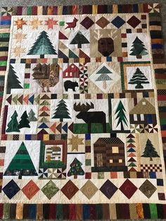 a quilt made to look like it has many trees on it