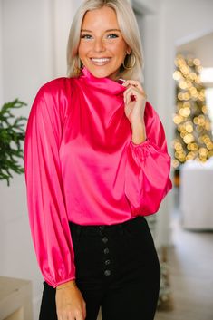 Embrace they joy that this blouse is going to bring! That satin fabric is so luxurious especially with that draped neckline! This bubble sleeve blouse is going to look amazing at the office or a nice restaurant! This blouse features long bubble sleeves, a draped cowl neck, a button keyhole back, and a sleek satin fabric. Material has no amount of stretch.Payton is wearing the small. Glamorous Pink Blouse For Night Out, Pink Satin Feminine Blouse, Pink Satin Top For Evening, Pink Satin Top For Work, Pink Satin Blouse In Feminine Style, Pink Satin Blouse For Night Out, Chic Pink Fall Blouse, Chic Pink Blouse For Fall, Formal Pink Satin Tops