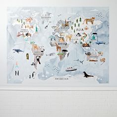 a white brick wall with a map of the world painted on it