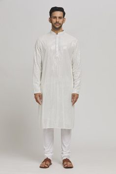 White cotton kurta with mirror and thread embroidery. Comes with churidar. - Aza Fashions Diwali White Sherwani With Mirror Work, Diwali Kurta With Mirror Work For Puja, Festive Kurta With Mirror Work For Traditional Ceremonies, Chanderi Kurta With Mirror Work For Puja, White Chanderi Sherwani With Mirror Work, Festive Churidar With Mirror Work For Puja, Traditional Churidar With Mirror Work For Puja, Traditional Mirror Work Churidar For Puja, White Chanderi Sherwani For Puja