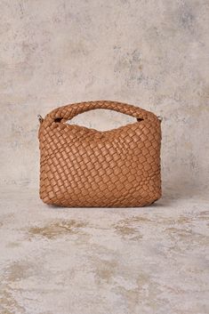 We love the new slouchy, Katya Woven Mini Crossbody Bag. With an integrated handle design, this petit woven style is currently trending. Crafted from ultra-soft vegan leather in classic Tan, it has a slouchy finish that makes it perfect for everyday use. Modern Natural Shoulder Bag With Intrecciato Weave, Beige Woven Leather Pouch Bag, Eco-friendly Handwoven Crossbody Bag, Eco-friendly Beige Handwoven Clutch, Eco-friendly Beige Woven Clutch, Leather Weaving, Mini Crossbody Bag, Handle Design, Mini Crossbody