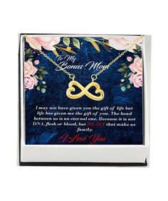 a card with an image of two intertwined hearts and flowers on it, in the middle