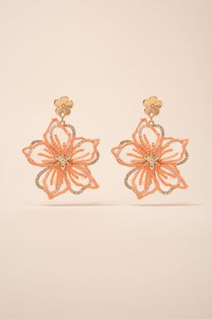 Make a statement with these beautiful Rhinestone Fabric Flower Earrings. These earrings are handmade with fabric flowers, embellished with shimmering rhinestones, creating a stunning and eye-catching look. Perfect for any special occasion or to add a touch of glamour to your everyday look. Shop now and add these unique earrings to your jewelry collection today! Size Length: 2.5 in (6.35 cm)Width: 2 in (5.08 cm) QualityEarrings are layered with two different flowers. Bottom flower with rhinestone Spring Party Beaded Earrings With Flower Shape, Spring Flower-shaped Beaded Earrings For Party, Spring Party Flower-shaped Beaded Earrings, Orange Flower Shaped Earrings For Party, Orange Flower Earrings For Party, Elegant Flower-shaped Beaded Earrings For Party, Gold Beaded Flower Earrings For Party, Fabric Flower Earrings, Rhinestone Fabric