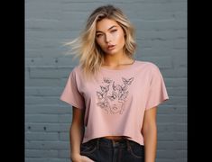 This unique bohemian butterfly artistic tee is perfect for any occasion.  Boho style with simplistic line art, butterflies, womans face.  Equipped with a flowy fit for easy-going appearances, this personalized women's cropped tee features a tailored sleeve along with a modest fit. Made with 65%/35% polyester/viscose fabric for stretchiness and equipped with a tear-away label for a scratch-free experience. .: 65% polyester, 35% viscose (fiber content may vary for different colors) .: Light fabric Trendy Tops With Butterfly Print And Relaxed Fit, Trendy Relaxed Fit Top With Butterfly Print, Casual T-shirt With Butterfly Print, Trendy Pink Butterfly Print Tops, Line Art Butterflies, Womans Face, Art Butterflies, Modest Fits, Mode Boho