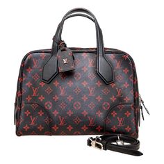 The Louis Vuitton Dora Soft Infrarouge Canvas MM Bag from the 2015 Spring/Summer collection is a stunning and edgy update from Creative Director Nicolas Ghesquiere. With a shiny black coated canvas and deep red monogram print, this bag combines history and modern design. Features include olive green lining with LV logo, palladium hardware eyelets and a small metal LV signature on the luggage tag. Inclusion: Shoulder strap. Remarks: There are some imperfections on the handles. Height:22;Width:31. Black Louis Vuitton Bag 1stdibs, Logo Lv, Louis Vuitton Store, Lv Logo, Louis Vuitton Speedy 30, Crocodile Bags, Lv Monogram, Nicolas Ghesquiere, Spring Summer Collection