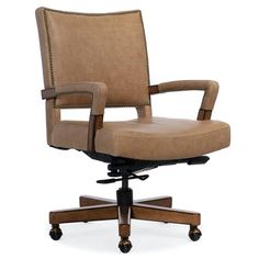 a brown office chair sitting on top of a wooden desk