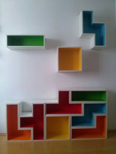 colorful shelves on the wall in an empty room