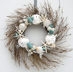 a wreath made out of sea shells and twigs