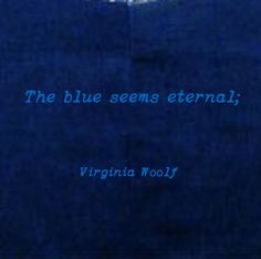 the blue seems external, virginia wooll is in front of an image with words on it