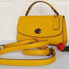 Brand New ~ Never Worn Classic Yellow Shoulder Bag With Top Carry Handle, Classic Yellow Satchel With Top Carry Handle, Classic Yellow Satchel With Detachable Handle, Classic Yellow Satchel With Adjustable Strap, Classic Yellow Coach Bag, Classic Yellow Satchel With Gold-tone Hardware, Classic Yellow Crossbody Satchel, Elegant Yellow Coach Shoulder Bag, Elegant Yellow Satchel With Adjustable Strap