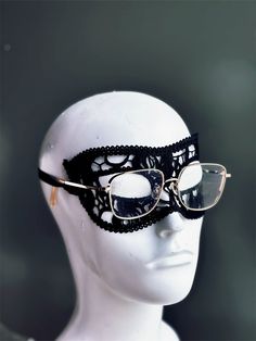 Crafted with meticulous precision and designed for ultimate comfort, this black lace mask allows you to keep your glasses on while indulging in the thrill of the masquerade. Perfect for formal events, costume parties, or any occasion where you want to make a dramatic entrance.

Age Group/Gender - Adult/Men

Size/Type - One size fits all adults

Mask Color - Black

Mask Material - Lace Masquerade Mask Lace, Black Lace Mask, Masquerade Mask Women, Black Masquerade, Black Masquerade Mask, Mens Masquerade Mask, Dramatic Entrance, Lace Mask, Costume Parties