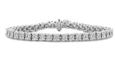 Zales 3/4 CT. T.W. Diamond Tennis Bracelet in 14K White Gold (I/I2) Timeless Diamond Channel Set Tennis Bracelet, Channel Set Round Cut Diamond Bracelet, Formal Diamond Tennis Bracelet Channel Set, Timeless Diamond Bracelet With Channel Set For Formal Occasions, Anniversary White Gold Channel Set Diamond Bracelet, Timeless Channel Set Diamond Bracelet For Formal Occasions, Timeless Channel Set Diamond Bracelet For Formal Events, Elegant Formal Channel Set Tennis Bracelet, Timeless Channel Set Tennis Bracelet For Anniversary