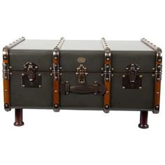 an antique trunk with two wooden handles and leather straps on the bottom is shown in front of a white background