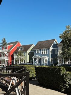 a row of houses with trees in the foreground