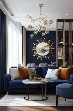 a living room with blue couches and gold accents