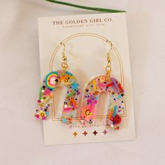 Playful Jewelry With Matching Earrings For Party, Fun Dangle Earrings For Party, Multicolor Resin Jewelry For Party, Whimsical Resin Jewelry For Party, Trendy Rainbow Earrings For Party, Trendy Rainbow Party Earrings, Playful Gold Earrings For Party, Cute Resin Jewelry For Party, Trendy Glitter Earrings For Party