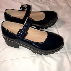 Very Nicely Made Dark Blue Patent Leather Mary Jane Style Of Shoes. Buckle Fastener On Outside Of Each Shoe. Chunky Rubber Soles Have 2-Inch Heel And 1 1/8” Thick Sole. Cushioned Insoles. Overall, These Shoes Look Sturdy And Nicely Crafted. Shoes Are New Without Tags Or Box. There Is No Name Brand On Them. There Is Also No Size Printed On Them. I Carefully Measured The Inside Of The Sole, From The Tip Of The Toe To The End Of The Heel. It Comes Out To 9 1/8”, Which Is The Measurement For Women’s Merry Jane Shoes, Dark Blue Clothes, Thrift Shoes, Dark Blue Shoes, Dark Blue Heels, Thrifted Shoes, Loafers Women, Ankle Strap Flats, Round Toe Shoes