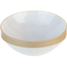 four white and gold plates stacked on top of each other