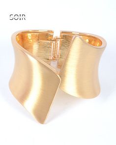 Introducing our Gilded Gleam Iconic Hinge Bangle, a must-have accessory that embodies timeless elegance with a modern twist. Crafted with meticulous attention to detail, this bangle features a stunning brushed gold finish that exudes sophistication and luxury. Its iconic hinged design adds a touch of versatility, allowing you to effortlessly pair it with any outfit, whether you're dressing up for a glamorous event or adding a chic accent to your everyday look. Elevate your style with the Gilded Swimsuit Skirt, Plus Size Swimsuits, Hinged Bangle, Swimsuit Cover Ups, Swimsuit Cover, New Arrival Dress, Gold Bangles, Accessories Earrings, Gold Finish