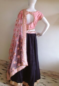 Hand embroidered semi raw silk top paired with a full flared black semi raw silk skirt. Dupatta is floral organza with beautiful borders. The skirt is also lined in cotton for additional body and comfort. Dress is custom made. Once you order I'll send you a measurements sheet which you need to fill out with your measurements. Please allow 1-2 weeks for the order to get processed and shipped as the dress is made with love just for you! Please contact us for other colors or any customizations. Shi Pink Sharara With Floral Embroidery In Tissue Silk, Pink Tissue Silk Sharara With Floral Embroidery, Black Sharara With Floral Embroidery, Black Organza Choli For Festive Occasions, Black Sharara With Floral Embroidery For Reception, Black Organza Sharara With Intricate Embroidery, Pink Silk Lehenga With Floral Embroidery, Black Silk Dupatta For Reception, Black Organza Choli With Traditional Drape