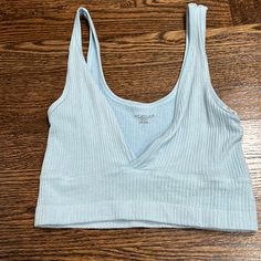 This Is A V Cut Urban Really Soft Light Blue Tank Never Worn Trendy Light Blue Top From Urban Outfitters, Urban Outfitters Casual Crop Top For Loungewear, Casual Urban Outfitters Crop Top For Loungewear, Casual Light Blue Crop Tank Top, Light Blue Summer Crop Top Tank, Urban Outfitters Blue Crop Top For Spring, Light Blue Seamless Tank Top, Casual Light Blue V-neck Crop Top, Cheap Light Blue V-neck Tank Top