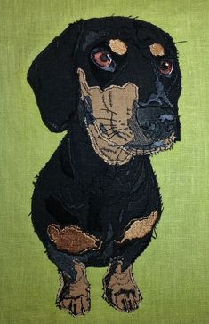 a painting of a black and tan dog on a green background with brown spots around it's eyes