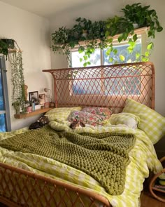 a bed that has some plants on top of it