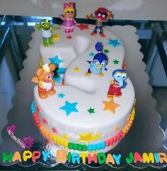 a birthday cake with sesame street characters on it